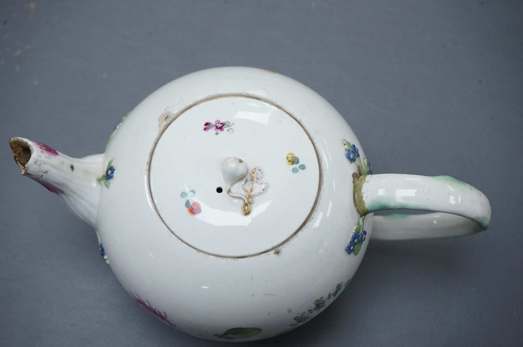The Hague, a late 18th century soft paste porcelain teapot, painted with polychrome flowers, 12cm high